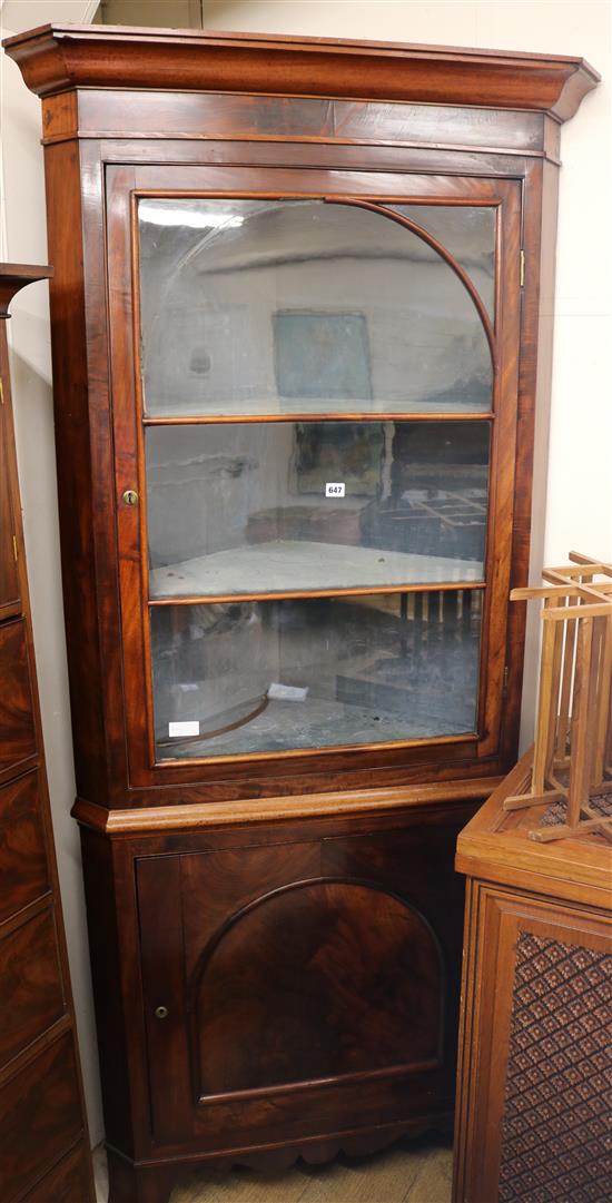 A Mahogany corner cupboard, c.1830, H.218cm